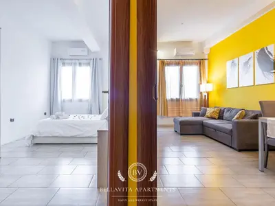 Letto o letti in una camera di BellaVita Apartments