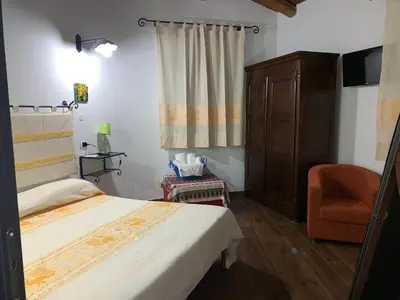 Letto o letti in una camera di Antica Potecarìa