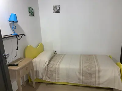 Letto o letti in una camera di Antica Potecarìa