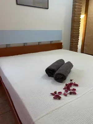 Letto o letti in una camera di Le dune