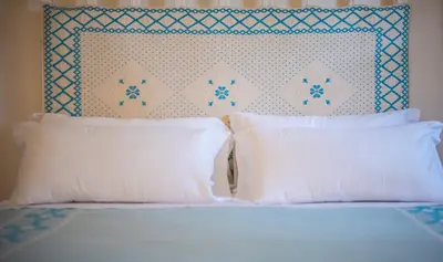 Letto o letti in una camera di Arbatax Park Resort - Borgo Cala Moresca