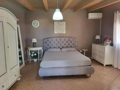 Letto o letti in una camera di Villa Rosi