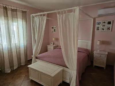 Letto o letti in una camera di Villa Rosi