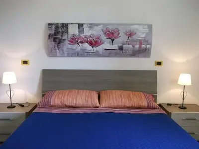 Letto o letti in una camera di Casa Maria Teresa