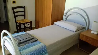 Letto o letti in una camera di Casa Maria Teresa
