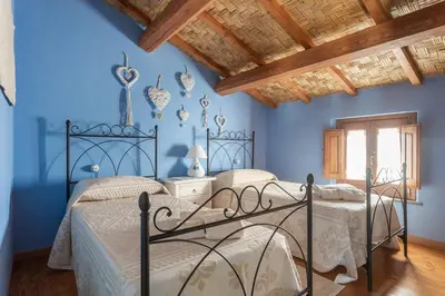 Letto o letti in una camera di Antica dimora dell'Arcolaio