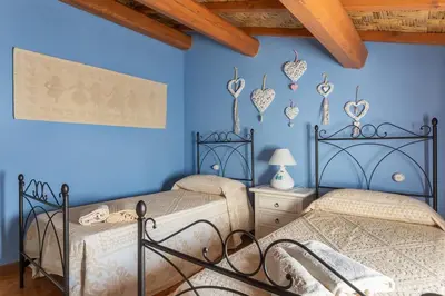 Letto o letti in una camera di Antica dimora dell'Arcolaio