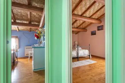 Letto o letti in una camera di Antica dimora dell'Arcolaio