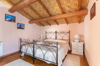 Letto o letti in una camera di Antica dimora dell'Arcolaio
