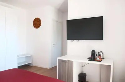 TV o dispositivi per l'intrattenimento presso Four Rooms Guesthouse