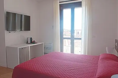 Letto o letti in una camera di Four Rooms Guesthouse