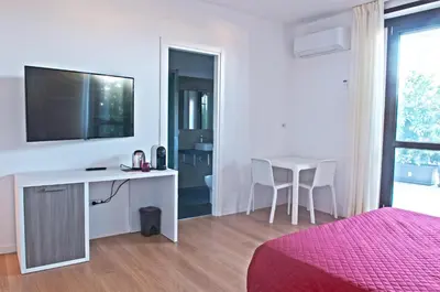 TV o dispositivi per l'intrattenimento presso Four Rooms Guesthouse