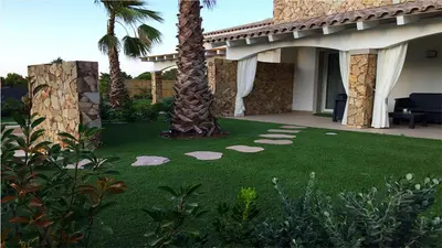 Giardino di RESIDENCE ELEGANCE ville ed appartamenti a Porto Pino