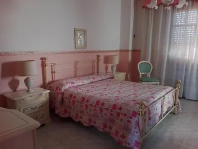 Letto o letti in una camera di B&B Lago Mulargia