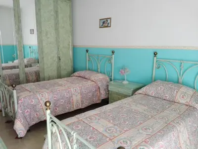 Letto o letti in una camera di B&B Lago Mulargia