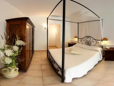 Letto o letti in una camera di Hotel Spartivento