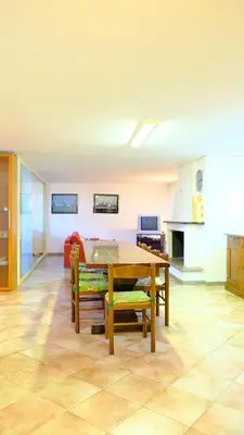 TV o dispositivi per l'intrattenimento presso La Baia Casa vacanze-Seminterrato