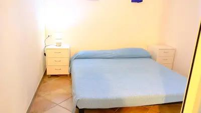Letto o letti in una camera di La Baia Casa vacanze-Seminterrato
