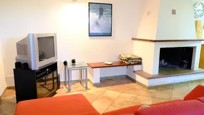 TV o dispositivi per l'intrattenimento presso La Baia Casa vacanze-Seminterrato