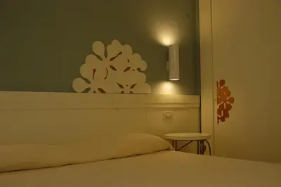 Letto o letti in una camera di Lantana Resort Hotel&Apartments