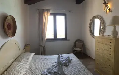 Letto o letti in una camera di Il Dolce Risveglio Tanca Piras