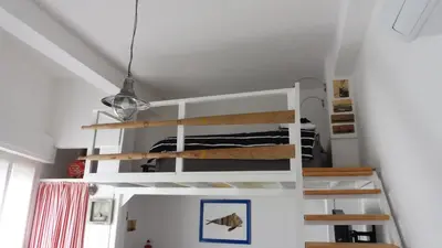 Letto o letti a castello in una camera di Sa Caletta Appartamenti