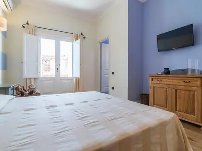 Letto o letti in una camera di Charming Rooms Opuntia