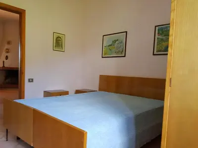 Letto o letti in una camera di Villa Carmen