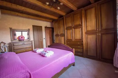Letto o letti in una camera di Casa Vacanza il Mandorlo