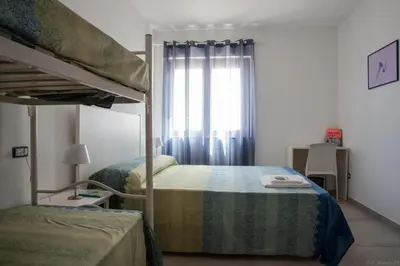 Letto o letti in una camera di B&B Agata e gli altri