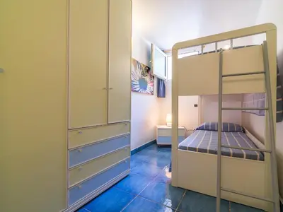 Letto o letti in una camera di Taccarossa casa azzurra