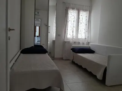 Letto o letti in una camera di Casa Lisa a Porto Frailis