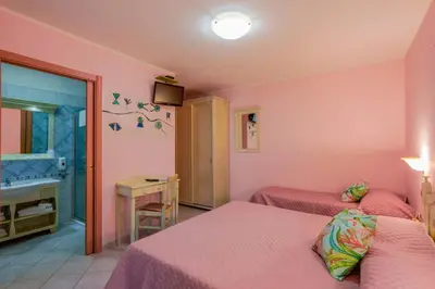 Letto o letti in una camera di Hotel Solanas
