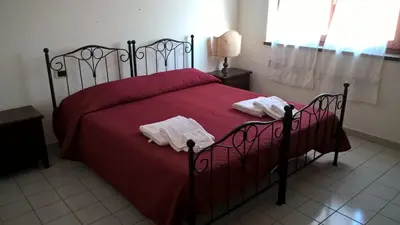 Letto o letti in una camera di La Terrazza Sul Parco