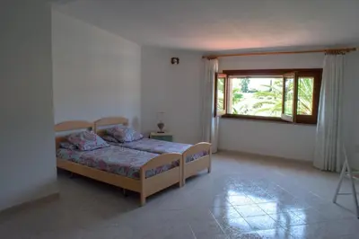 Letto o letti in una camera di villa sa perdera