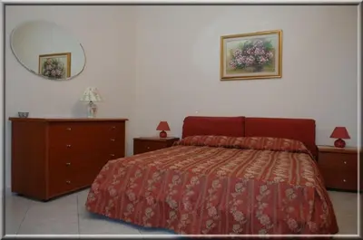 Letto o letti in una camera di B&B Ida