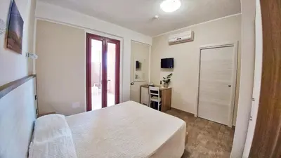 Letto o letti in una camera di Hotel Meridiana