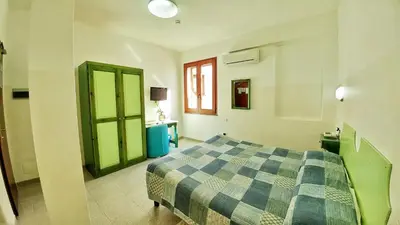 Letto o letti in una camera di Hotel Meridiana