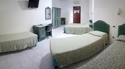 Letto o letti in una camera di Hotel Meridiana
