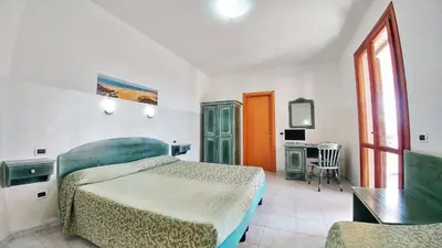 Letto o letti in una camera di Hotel Meridiana