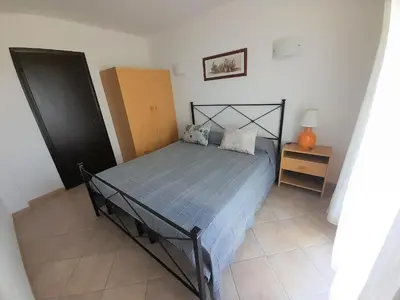 Letto o letti in una camera di Nuova Valmar 