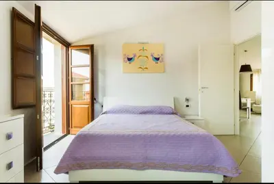 Letto o letti in una camera di B&B su Coccu