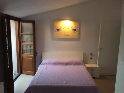 Letto o letti in una camera di B&B su Coccu