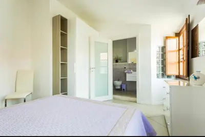 Letto o letti in una camera di B&B su Coccu