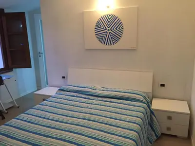 Letto o letti in una camera di B&B su Coccu
