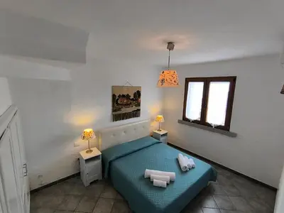 Letto o letti in una camera di A Strapiombo sul Mare Tanca Piras