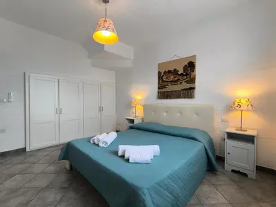 Letto o letti in una camera di A Strapiombo sul Mare Tanca Piras
