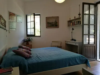 Letto o letti in una camera di Villetta nella Pineta Santa Margherita di Pula