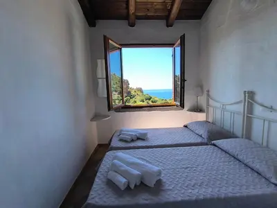 Letto o letti in una camera di Villa Laura Tanca Piras