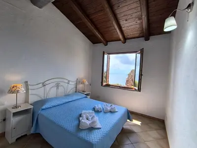 Letto o letti in una camera di Villa Laura Tanca Piras